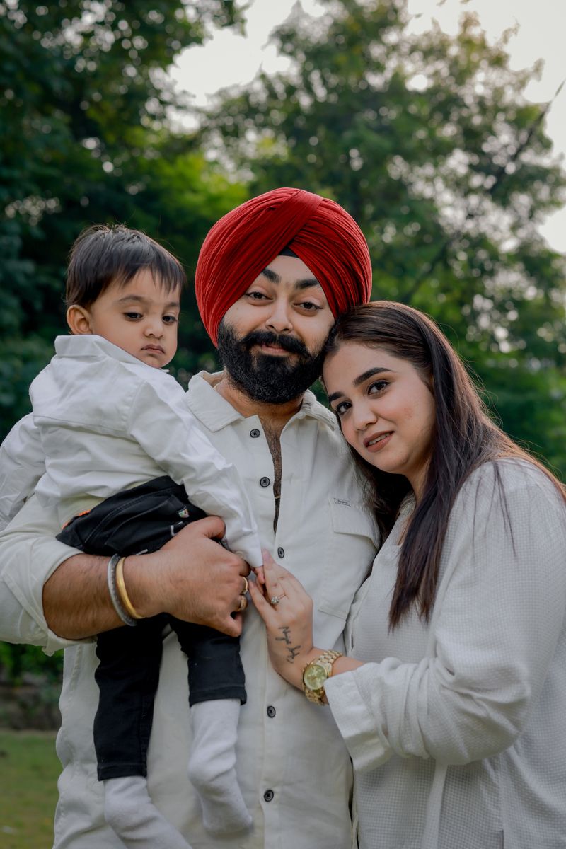 A smiling family together outdoors